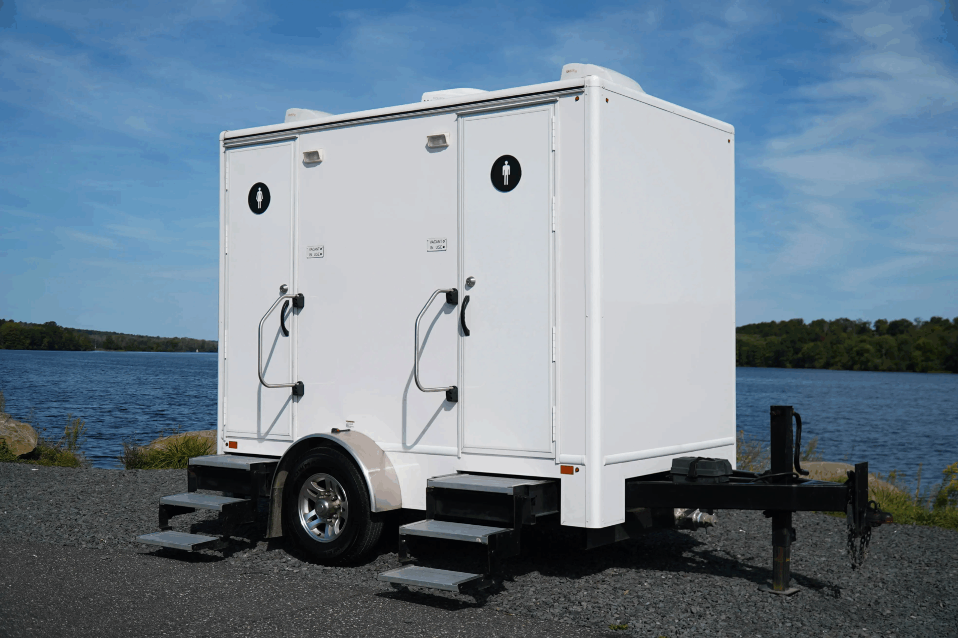 Luxury 2-stall restroom trailer by a scenic lakeside venue in South Georgia